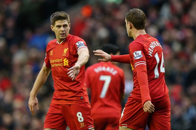 LIVERPOOL, ENGLAND - FEBRUARY 23:  Jordan Henderson of Liverpool celebrates scoring his team's fourth goal with his team-mate Steven Gerrard during the Barclays Premier League match between Liverpool and Swansea City at Anfield on February 23, 2014 in Liverpool, England.  (Photo by Clive Brunskill/Getty Images)