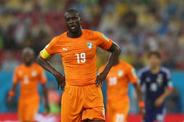 RECIFE, BRAZIL - JUNE 14: Yaya Toure of the Ivory Coast looks on in the rain during the 2014 FIFA World Cup Brazil Group C match  between the Ivory Coast and Japan at Arena Pernambuco on June 14, 2014 in Recife, Brazil.  (Photo by Jamie Squire/Getty Images)