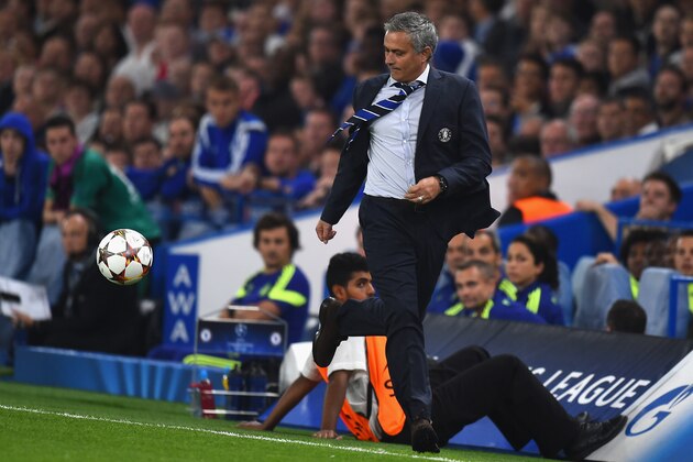 LONDON, ENGLAND - SEPTEMBER 17:  Chelsea manager Jose Mourinho chases the ball down the wing during the UEFA Champions League Group G match between Chelsea FC and FC Schalke 04 at Stamford Bridge on September 17, 2014 in London, United Kingdom.  (Photo by Mike Hewitt/Getty Images)