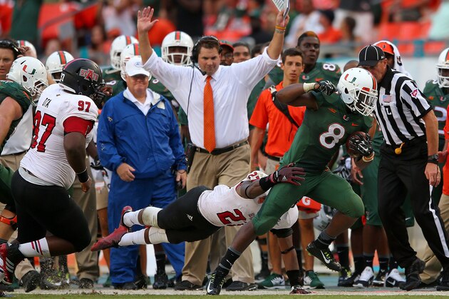 MIAMI, FL - SEPTEMBER 13:  Duke Johnson #8 of the Miami Hurricanes rushes during a game against the Arkansas State Red Wolves at Sunlife Stadium on September 13, 2014 in Miami, Florida.  (Photo by Mike Ehrmann/Getty Images)