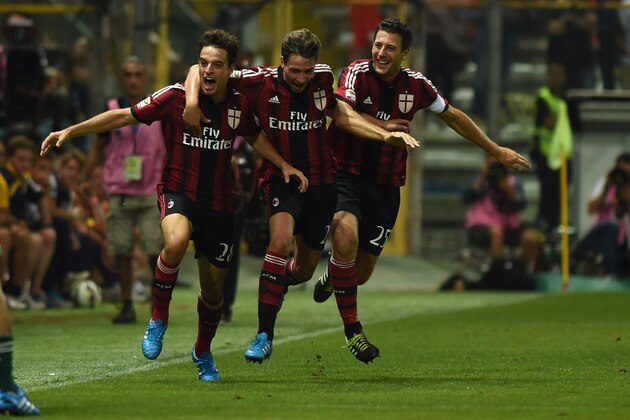 PARMA, ITALY - SEPTEMBER 14:  Giacomo Bonaventura (L) of AC Milan celebrate the opening goal with team-mate Mattia De Sciglio (C) and Daniele Bonera during the Serie A match between Parma FC and AC Milan at Stadio Ennio Tardini on September 14, 2014 in Parma, Italy.  (Photo by Valerio Pennicino/Getty Images)