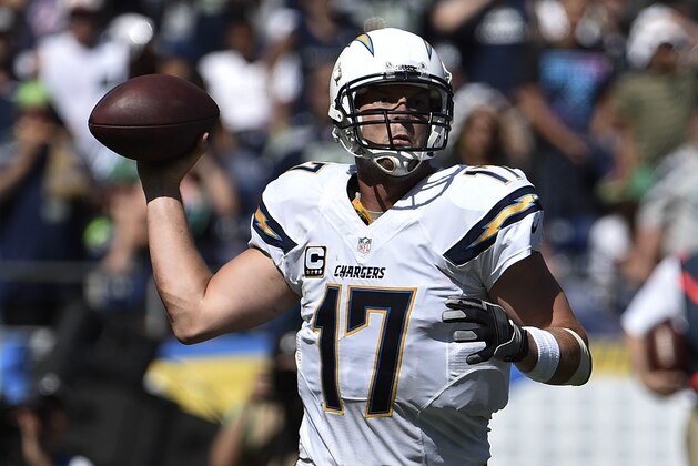 San Diego Chargers quarterback Philip Rivers (17) throws a pass during the first quarter of an NFL football game against the Seattle Seahawks Sunday, Sept. 14, 2014 in San Diego.  (AP Photo/Denis Poroy)