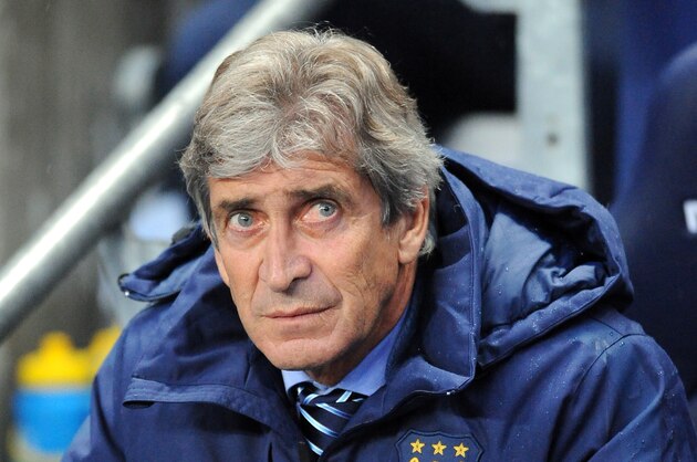 Manchester City manager Manuel Pellegrini watches the game during the English Premier League soccer match between Manchester City and Liverpool at the Etihad Stadium, in Manchester, England, Monday, Aug. 25, 2014. (AP Photo/Rui Vieira)