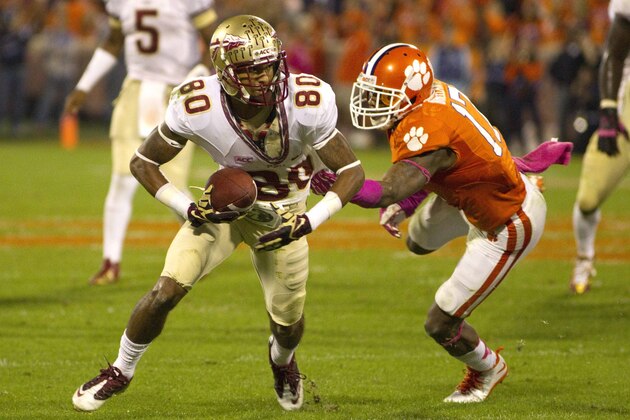 Oct 19, 2013; Clemson, SC, USA; Florida State Seminoles wide receiver Rashad Greene (80) avoids a tackle by Clemson Tigers defensive back Bashaud Breeland (17) during the first half at Clemson Memorial Stadium. Mandatory Credit: Joshua S. Kelly-USA TODAY Sports