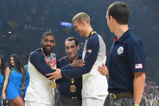 MADRID, SPAIN - SEPTEMBER 14: Kyrie Irving, Head Coach Mike Krzyzewski and Mason Plumlee of the USA Men's National Team celebrates after defeating  the Serbia National Team in the 2014 FIBA World Cup Finals at Palacio de Deportes on September 14, 2014 in Madrid, Spain.  NOTE TO USER: User expressly acknowledges and agrees that, by downloading and/or using this Photograph, user is consenting to the terms and conditions of the Getty Images License Agreement. Mandatory Copyright Notice: Copyright 2014 NBAE (Photo by Jesse D. Garrabrant/NBAE via Getty Images)