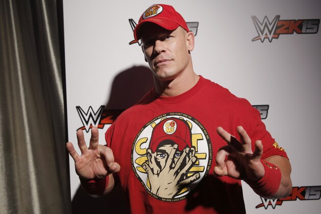 WWE 2K15 cover Superstar John Cena attends the WWE 2K15 SummerSlam Confidential Panel at Club Nokia, on Saturday, August 16, 2014 in Los Angeles. (Photo by Todd Williamson/Invision for 2K/AP Images)