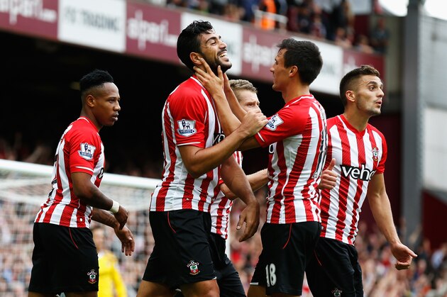 LONDON, ENGLAND - AUGUST 30:  Graziano Pelle of Southampton celebrates scoring his team's third goal with team mates during the Barclays Premier League match between West Ham United and Southampton at Boleyn Ground on August 30, 2014 in London, England.  (Photo by Steve Bardens/Getty Images)