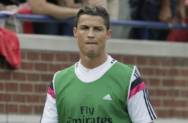Real Madrid's Cristiano Ronaldo reacts after missing a chance during the Champions League Group B soccer match between Real Madrid and Basel at the Santiago Bernabeu stadium in Madrid, Spain, Tuesday Sept. 16, 2014. (AP Photo/Daniel Ochoa de Olza)