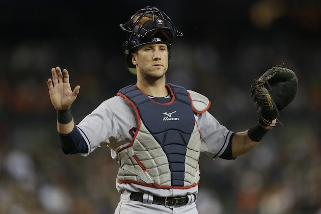 Cleveland Indians catcher Yan Gomes signals to the bench during the fifth inning of a baseball game against the Detroit Tigers in Detroit, Saturday, Sept. 13, 2014. (AP Photo/Carlos Osorio)