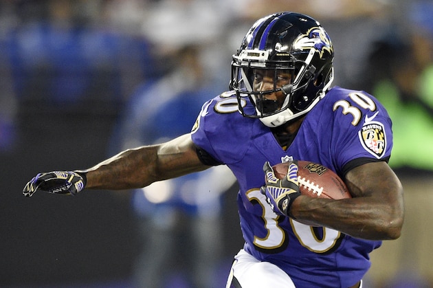 Baltimore Ravens running back Bernard Pierce rushes the ball in the first half of an NFL preseason football game against the Washington Redskins, Saturday, Aug. 23, 2014, in Baltimore. (AP Photo/Nick Wass)