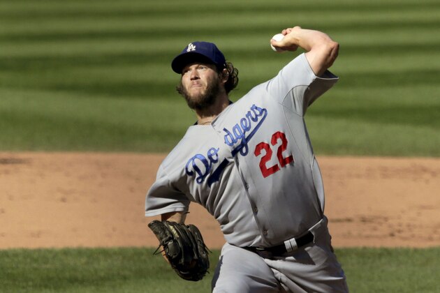Los Angeles Dodgers starting pitcher Clayton Kershaw delivers during the fifth inning of a baseball game against the Chicago Cubs, Friday, Sept. 19, 2014, in Chicago. (AP Photo/Charles Rex Arbogast)