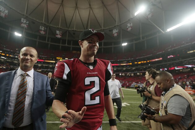 Atlanta Falcons quarterback Matt Ryan (2) walks off the field after the second half of an NFL football game against the Tampa Bay Buccaneers, Thursday, Sept. 18, 2014, in Atlanta.   The Atlanta Falcons won 56-14. (AP Photo/John Bazemore)