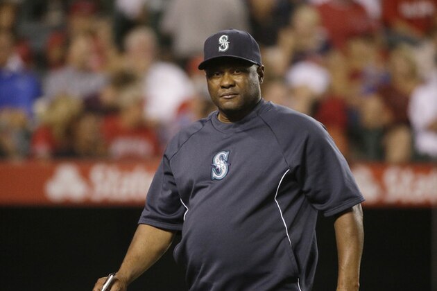 Seattle Mariners manager Lloyd McClendon returns to dugout after a lineup change during the sixth inning of a baseball game against the Los Angeles Angels Monday, Sept. 15, 2014, in Anaheim, Calif. (AP Photo/Jae C. Hong)