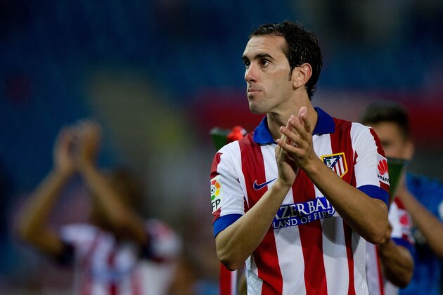 MADRID, SPAIN - AUGUST 30:  Diego Godin of Atletico de Madrid clpas to the audience during the celebration held after the La Liga match between Club Atletico de Madrid and SD Eibar at Vicente Calderon Stadium on August 30, 2014 in Madrid, Spain.  (Photo by Gonzalo Arroyo Moreno/Getty Images)