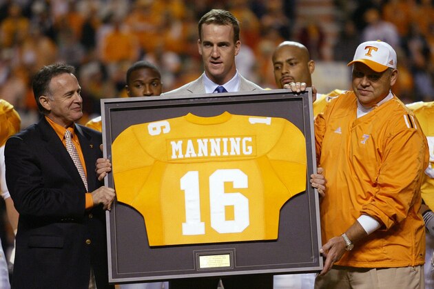 Indianapolis Colts quarterback and former Tennessee quarterback, Peyton Manning holds a framed jersey along with University of Tennessee president John Petersen, left, and coach Philip Fulmer as his number was retired before the game with South Carolina Saturday, Oct. 29, 2005 in Knoxville, Tenn.(AP Photo/Wade Payne) Indianapolis Colts quarterback and former Tennessee quarterback, Peyton Manning holds a framed jersey along with University of Tennessee president John Petersen, left, and coach Philip Fulmer as his number was retired before the game with South Carolina Saturday, Oct. 29, 2005 in Knoxville, Tenn.(AP Photo/Wade Payne)