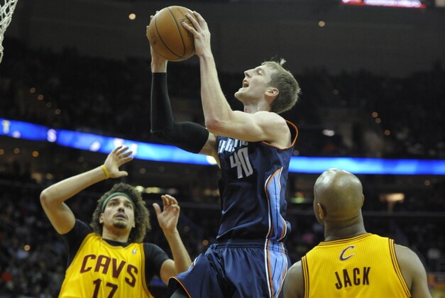 Apr 5, 2014; Cleveland, OH, USA; Charlotte Bobcats center Cody Zeller (40) drives between Cleveland Cavaliers center Anderson Varejao (17) and guard Jarrett Jack (1) in the first quarter at Quicken Loans Arena. Mandatory Credit: David Richard-USA TODAY Sports