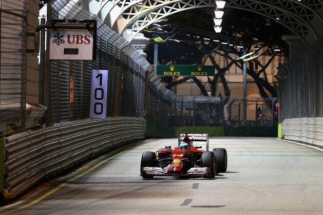 SINGAPORE - SEPTEMBER 19:  Fernando Alonso of Spain and Ferrari drives during practice ahead of the Singapore Formula One Grand Prix at Marina Bay Street Circuit on September 19, 2014 in Singapore, Singapore.  (Photo by Clive Mason/Getty Images)