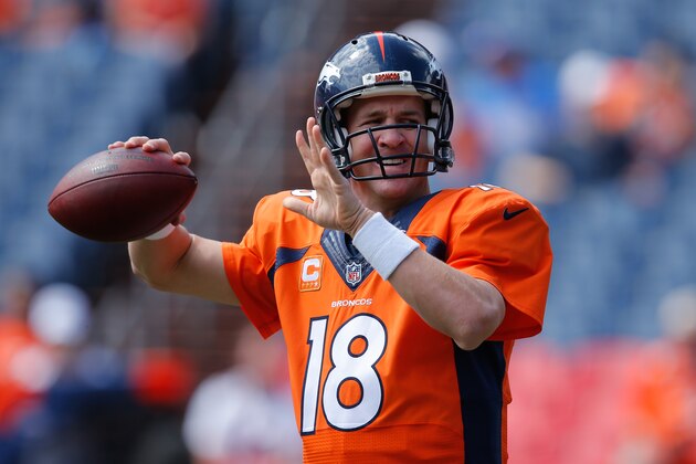 DENVER, CO - SEPTEMBER 14:  Quarterback Peyton Manning #18 of the Denver Broncos throws as he warms up before a game against the Kansas City Chiefs at Sports Authority Field at Mile High on September 14, 2014 in Denver, Colorado.  (Photo by Doug Pensinger/Getty Images)