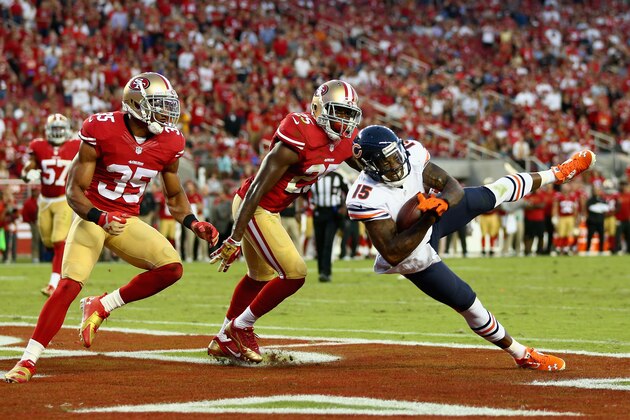 SANTA CLARA, CA - SEPTEMBER 14:  Wide receiver Brandon Marshall #15 of the Chicago Bears catches a pass for a touchdown while defended by free safety Eric Reid (L) #35 and strong safety Jimmie Ward #25 of the San Francisco 49ers in the second quarter at Levi's Stadium on September 14, 2014 in Santa Clara, California.  (Photo by Jeff Gross/Getty Images)