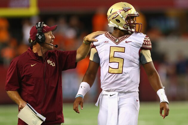 ARLINGTON, TX - AUGUST 30:  (L-R) Head coach Jimbo Fisher of the Florida State Seminoles talks with Jameis Winston #5 in the fourth quarter of play against the Oklahoma State Cowboys at AT&T Stadium on August 30, 2014 in Arlington, Texas.  (Photo by Ronald Martinez/Getty Images)