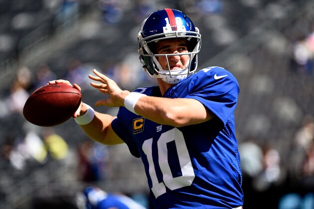 EAST RUTHERFORD, NJ - SEPTEMBER 14:  Quarterback Eli Manning #10 of the New York Giants warms up prior to a game against the Arizona Cardinals at MetLife Stadium on September 14, 2014 in East Rutherford, New Jersey.  (Photo by Alex Goodlett/Getty Images)