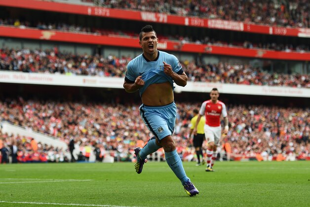 LONDON, ENGLAND - SEPTEMBER 13:  Sergio Aguero of Manchester City celebrates scoring the opening goal during the Barclays Premier League match between Arsenal and Manchester City at Emirates Stadium on September 13, 2014 in London, England.  (Photo by Shaun Botterill/Getty Images)