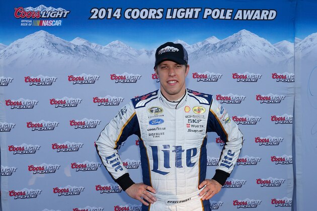 LOUDON, NH - SEPTEMBER 19:  Brad Keselowski, driver of the #2 Miller Lite Ford, celebrate setting the pole position during qualifying for the NASCAR Sprint Cup Series Sylvania 300 at New Hampshire Motor Speedway on September 19, 2014 in Loudon, New Hampshire.  (Photo by Chris Trotman/Getty Images)