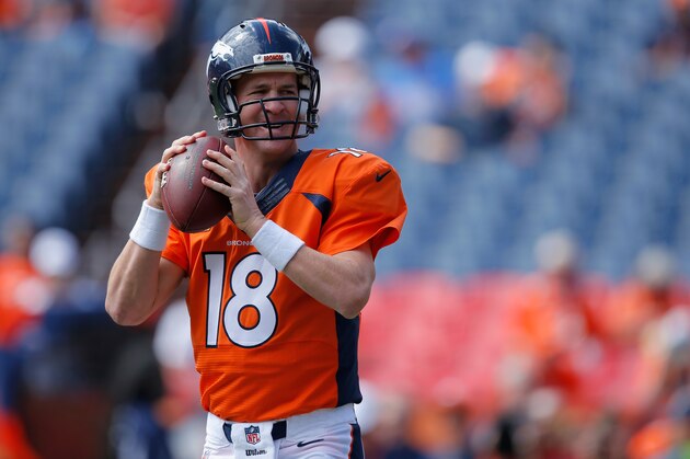 DENVER, CO - SEPTEMBER 14:  Quarterback Peyton Manning #18 of the Denver Broncos warms up prior to facing the Kansas City Chiefs at Sports Authority Field at Mile High on September 14, 2014 in Denver, Colorado. The Broncos defeated the Chiefs 24-17.  (Photo by Doug Pensinger/Getty Images)