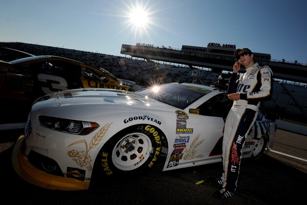 LOUDON, NH - SEPTEMBER 19:  Brad Keselowski, driver of the #2 Miller Lite Ford, stands by his car on pit road during qualifying for the NASCAR Sprint Cup Series Sylvania 300 at New Hampshire Motor Speedway on September 19, 2014 in Loudon, New Hampshire.  (Photo by Will Schneekloth/Getty Images)