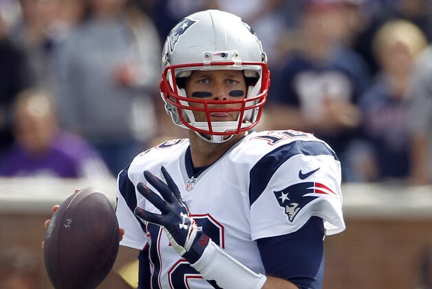 New England Patriots quarterback Tom Brady looks to pass during the second quarter of an NFL football game against the Minnesota Vikings Sunday, Sept. 14, 2014, in Minneapolis. (AP Photo/Ann Heisenfelt)