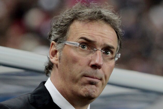 Paris Saint Germain's French coach Laurent Blanc  attends prior the French League Cup final football match Lyon between Paris Saint-Germain (PSG) and Lyon at the Stade de France in Saint Denis, north of Paris, Saturday April 19, 2014. (AP Photo/Jacques Brinon)
