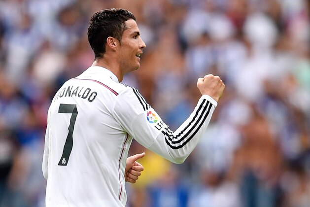 LA CORUNA, SPAIN - SEPTEMBER 20: Cristiano Ronaldo of Real Madrid CF celebrates after scoring the opening goal  during the La Liga match between RC Deportivo La Coruna and Real Madrid CF at Riazor Stadium on September 20, 2014 in La Coruna, Spain.  (Photo by David Ramos/Getty Images)