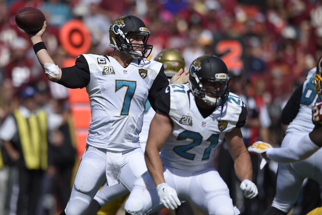 Jacksonville Jaguars quarterback Chad Henne (7) looks to pass as Toby Gerhart (21) blocks during the first half of an NFL football game against the Washington Redskins, Sunday, Sept. 14, 2014, in Landover, Md. (AP Photo/Nick Wass)