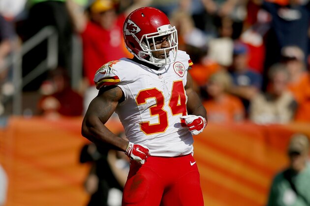 Kansas City Chiefs running back Knile Davis (34) celebrates his touchdown against the Denver Broncos during the first half of an NFL football game, Sunday, Sept. 14, 2014, in Denver. (AP Photo/Jack Dempsey)