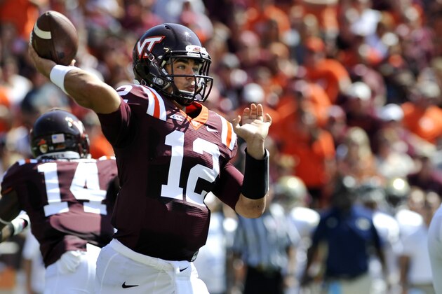 BLACKSBURG, VA - SEPTEMBER 20:  Quarterback Michael Brewer #12 of the Virginia Tech Hokies throws a pass against the Georgia Tech Yellow Jackets in the first half at Lane Stadium on September 20, 2014 in Blacksburg, Virginia. (Photo by Michael Shroyer/Getty Images)