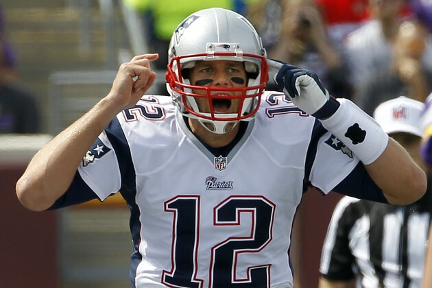 New England Patriots quarterback Tom Brady yells on the line of scrimmage during the first quarter of an NFL football game against the Minnesota Vikings, Sunday, Sept. 14, 2014, in Minneapolis. (AP Photo/Ann Heisenfelt)