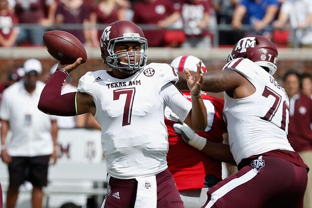 DALLAS, TX - SEPTEMBER 20:  Kenny Hill #7 of the Texas A&M Aggies looks to pass during the first half of their game against the Southern Methodist Mustangs at the Gerald J. Ford Stadium on September 20, 2014 in Dallas, Texas.  (Photo by Scott Halleran/Getty Images)