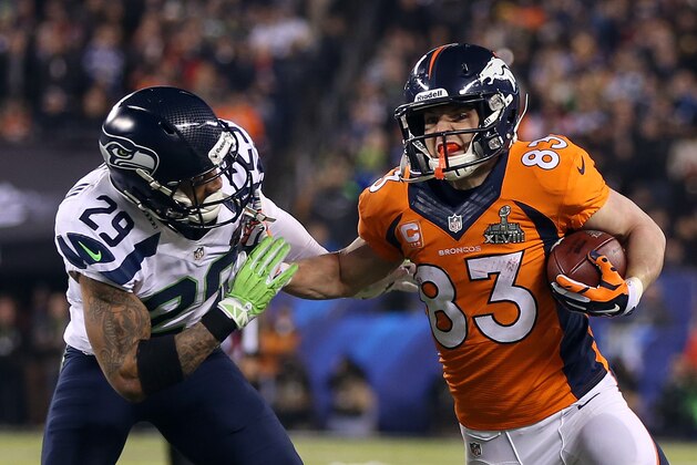 EAST RUTHERFORD, NJ - FEBRUARY 02:  Wide receiver Wes Welker #83 of the Denver Broncos tries to avoid the tackle of free safety Earl Thomas #29 of the Seattle Seahawks during Super Bowl XLVIII at MetLife Stadium on February 2, 2014 in East Rutherford, New Jersey.  (Photo by Jeff Gross/Getty Images)