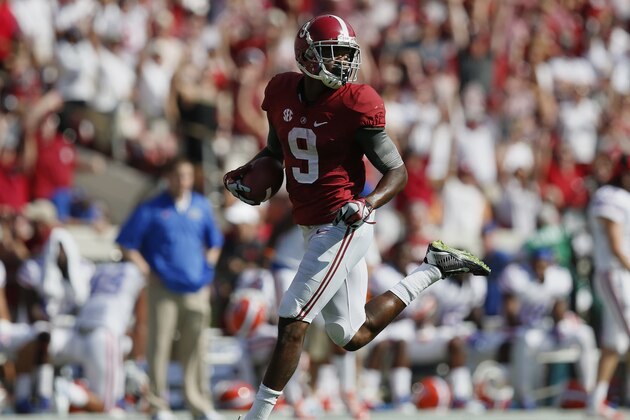 Alabama wide receiver Amari Cooper (9) runs in for a touchdown against Florida in the first half of an NCAA college football game on Saturday, Sept. 20, 2014, in Tuscaloosa, Ala. (AP Photo/Brynn Anderson)