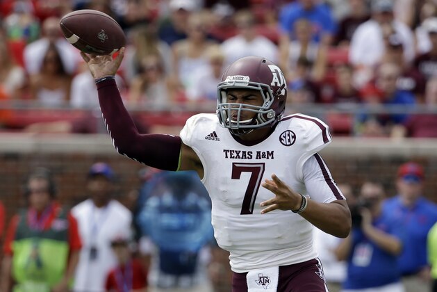 Texas A&M quarterback Kenny Hill (7) passes against SMU in the first half of an NCAA college football game,  Saturday, Sept. 20, 2014, in Dallas. (AP Photo/Tony Gutierrez)