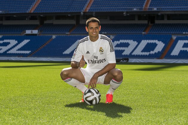 Mexico's international soccer player Javier Hernandez 'Chicharito', poses during his official presentation at the Santiago Bernabeu stadium in Madrid, Spain, Monday, Sept. 1, 2014, after signing for Real Madrid. (AP Photo/Andres Kudacki)