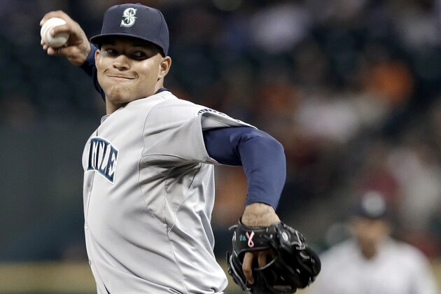 Seattle Mariners' Taijuan Walker delivers a pitch against the Houston Astros in the first inning of a baseball game Friday, Sept. 19, 2014, in Houston. (AP Photo/Pat Sullivan)