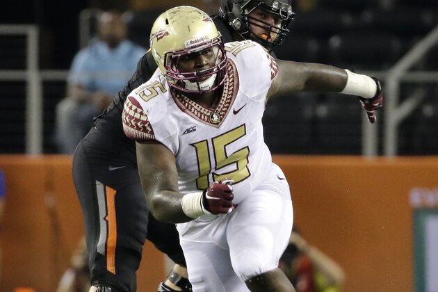 Oklahoma State offensive linesman Daniel Koenig, rear, defends against a rush by Florida State defensive end Mario Edwards Jr. (15) during an NCAA college football game, Saturday, Aug. 30, 2014, in Arlington, Texas. (AP Photo/Tony Gutierrez)