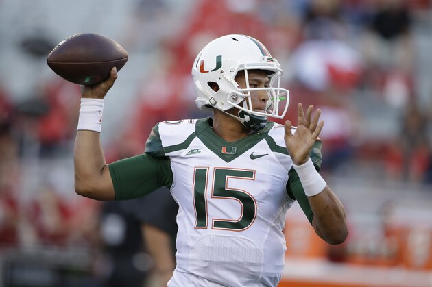 Miami quarterback Brad Kaaya (15) throws during warmups before an NCAA college football game against Nebraska in Lincoln, Neb., Saturday, Sept. 20, 2014. (AP Photo/Nati Harnik)