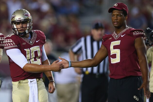TALLAHASSEE, FL - SEPTEMBER 20:  Jameis Winston #5 of the Florida State Seminoles shakes hands with Sean Maguire #10 on the field during pregame against the Clemson Tigers at Doak Campbell Stadium on September 20, 2014 in Tallahassee, Florida.  (Photo by Ronald Martinez/Getty Images)
