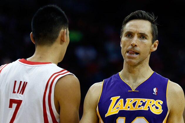 HOUSTON, TX - JANUARY 08:  Steve Nash #10 of the Los Angeles Lakers waits on the court alongside Jeremy Lin #7 of the Houston Rockets at Toyota Center on January 8, 2013 in Houston, Texas. Nash became just the fifth player in NBA history to reach 10,000 career assists Tuesday night. NOTE TO USER: User expressly acknowledges and agrees that, by downloading and or using this photograph, User is consenting to the terms and conditions of the Getty Images License Agreement.  (Photo by Scott Halleran/Getty Images)