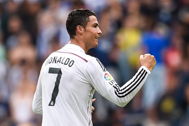 LA CORUNA, SPAIN - SEPTEMBER 20:  Cristiano Ronaldo of Real Madrid CF celebrates after scoring the opening goal  during the La Liga match between RC Deportivo La Coruna and Real Madrid CF at Riazor Stadium on September 20, 2014 in La Coruna, Spain.  (Photo by David Ramos/Getty Images)