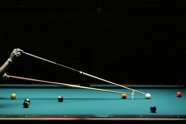 Carla Remington, from Coral Springs, Fla., uses a bridge in the Women's 9-ball championship match during the Gay Games VII Pool Billiards event Friday, July 21, 2006, in Chicago. Remington advanced to the gold medal game from the losers bracket of the double-elimination tournament by defeating Deb Lecki from Warrenville, Ill., twice in the best of seven game matches, erasing a 0-3 deficit in the second match to win the gold medal. (AP Photo/Charles Rex Arbogast) Carla Remington, from Coral Springs, Fla., uses a bridge in the Women's 9-ball championship match during the Gay Games VII Pool Billiards event Friday, July 21, 2006, in Chicago. Remington advanced to the gold medal game from the losers bracket of the double-elimination tournament by defeating Deb Lecki from Warrenville, Ill., twice in the best of seven game matches, erasing a 0-3 deficit in the second match to win the gold medal. (AP Photo/Charles Rex Arbogast)