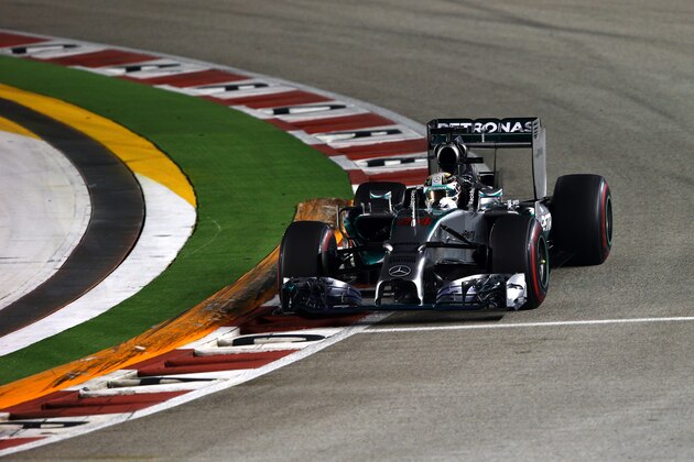 SINGAPORE - SEPTEMBER 21:  Lewis Hamilton of Great Britain and Mercedes GP drives during the Singapore Formula One Grand Prix at Marina Bay Street Circuit on September 21, 2014 in Singapore, Singapore.  (Photo by Mark Thompson/Getty Images)