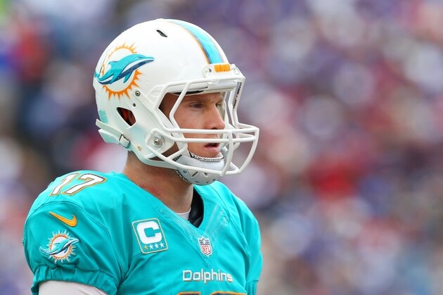 Miami Dolphins quarterback Ryan Tannehill (17) walks to the sidelines during the first half of an NFL football game against the Buffalo Bills on Sunday, Sept. 14, 2014, in Orchard Park, N.Y. (AP Photo/Bill Wippert)